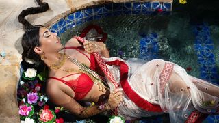 Wrapped in a brilliant red sari Jasmine Sherni rubs her pretty pussy until she orgasms!